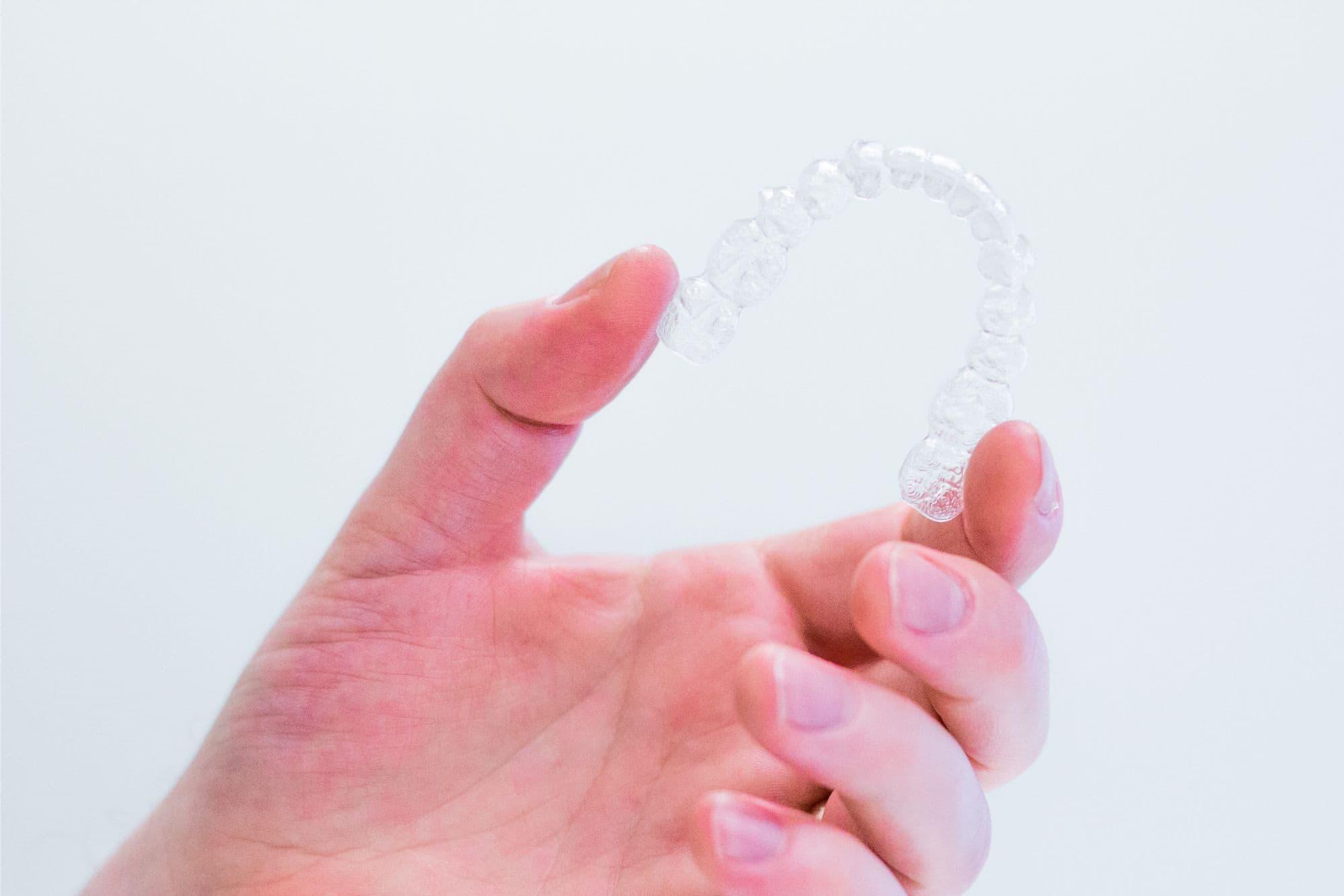 hand-holding-unbranded-aligners